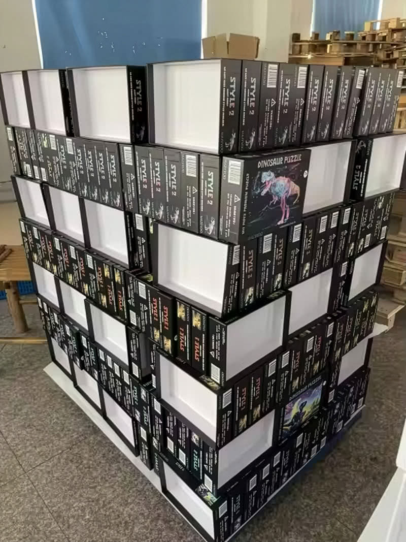 Stacks of boxed puzzles prepared for donation